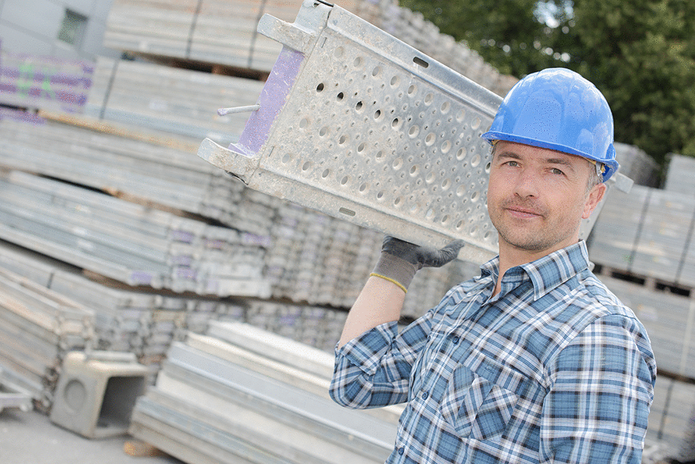 Construction Worker holding aluminum scaffolding